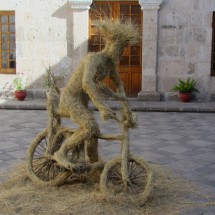 Bicycle rider close the entrance of the convent Santa Catalina in Arequipa
